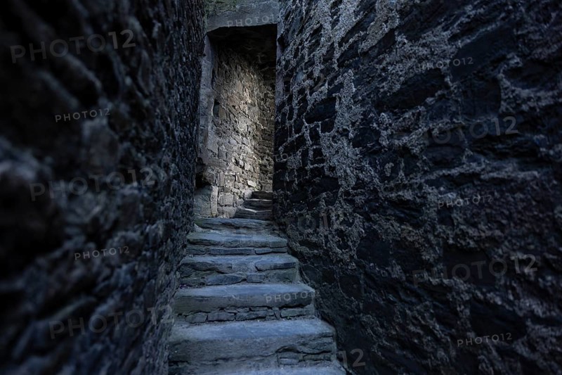 Conwy Castle, medieval stone staircase of the castle winds through narrow, dark and historic corridors, Conwy, Wales, United Kingdom, Europe