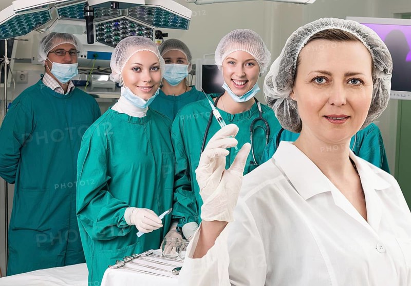 Adult female anesthetist with syringe on the surgery teem background