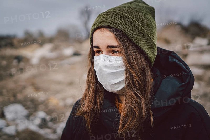 Portrait of young woman wearing medical mask, health protection from influenza virus, epidemic and infectious diseases. Protect your health. Coronavirus concept. Virus spread flu prevention carantine