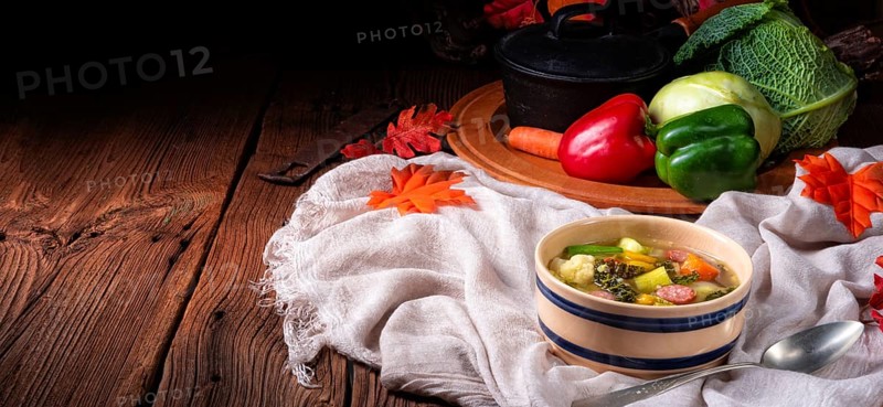 Delicious autumnal vegetable soup with sausage and bacon