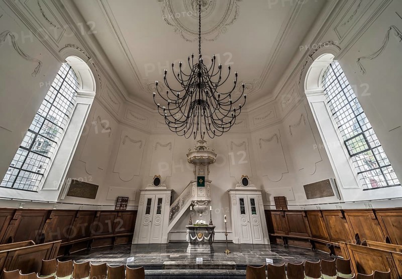 Monschau Old Town, North Rhine-Westphalia, Germany, 08 27 2019 Interior design of the Catholic church with a chandelier, Europe