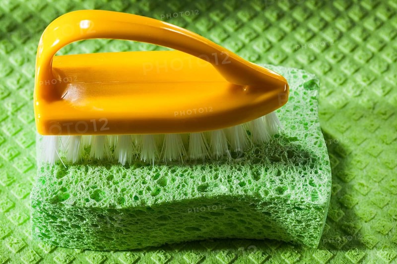 New plastic brush sponge on dishcloth