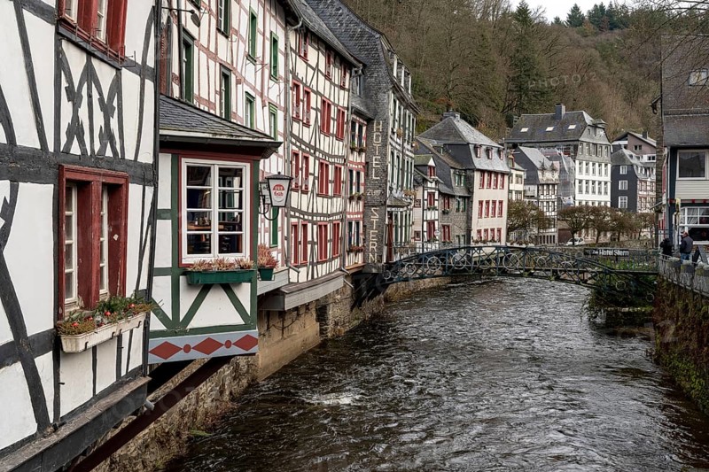 City Monschau in Region national park Eifel. Old town with old houses and river Rur