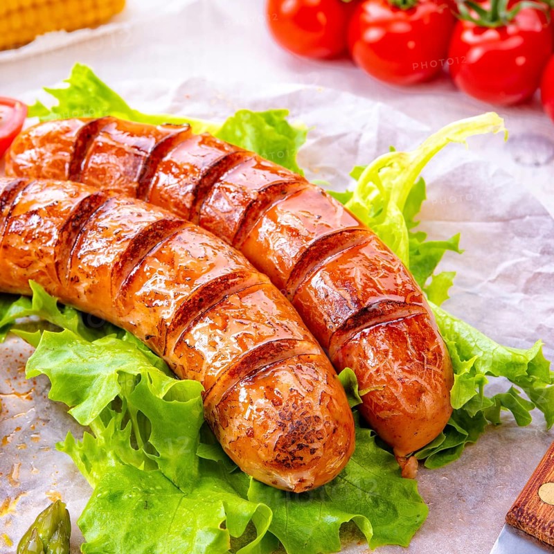 Grilled krakauer sausage with boiled corn and green salad
