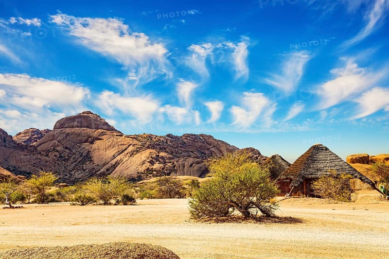 Africa. Namibia. Spitzkoppe is a small picturesque rock massif in Namibia. Magnificent stone red-orange remains of Spitzkoppe from coarse-grained granite