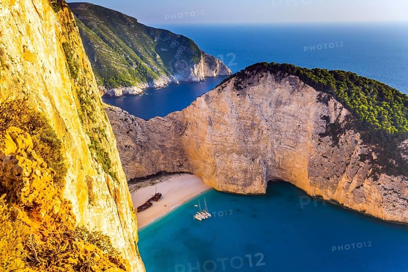 Famous Shipwreck Beach. Romantic fabulous sunset. The picturesque coast of the Greek island of Zakynthos. The concept of active, ecological and photo tourism