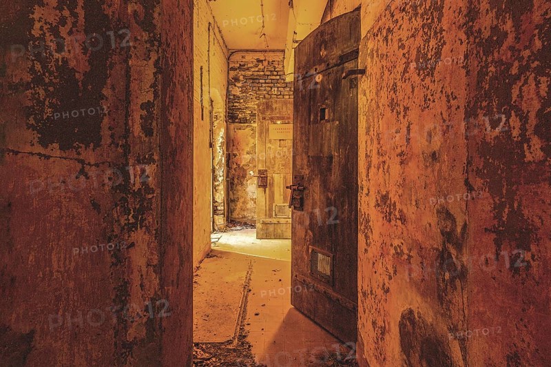 Dilapidated corridor with open doors and rusty walls, gloomy and mysterious, Prison H11, Lost Place, Verviers, Province of Liège, Belgium, Europe