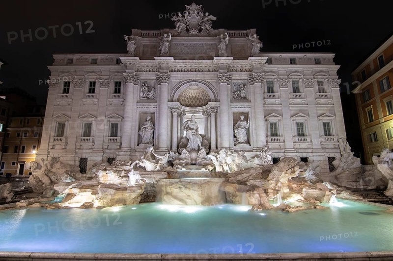 The Trevi Fountain, one o'clock in the morning at the blue hour. No people, but well lit. Monumental fountain on the Piazza di Trevi in front of Palazzo Poli. Fontana di Trevi, Rome, Italy, Europe