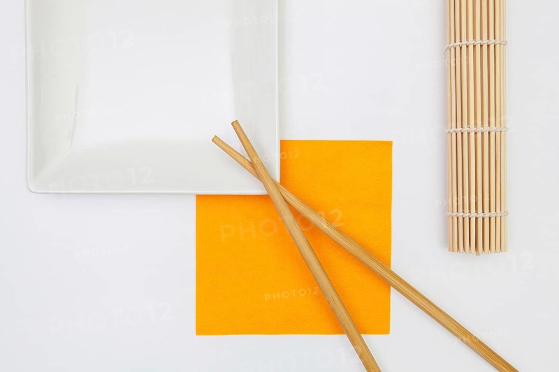 Top View Of White Empty Sushi Plates With Bamboo Chopsticks. Symmetry Food Design