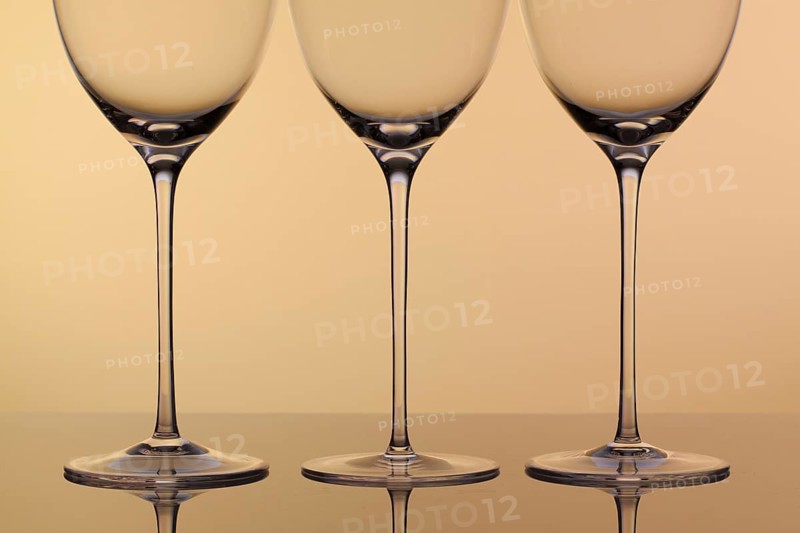 Three empty glasses of wine on a clean background