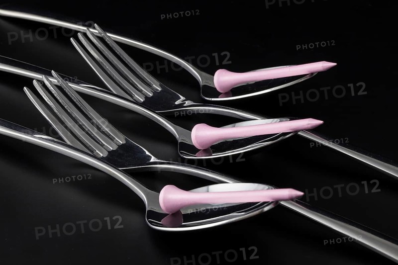 Forks and spoons on a black table