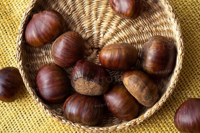 Fresh edible chestnuts in a basket