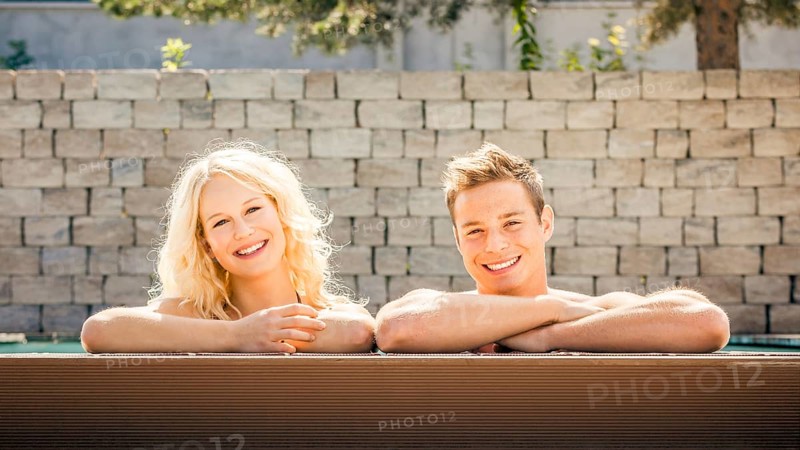 An image of a young couple at the pool