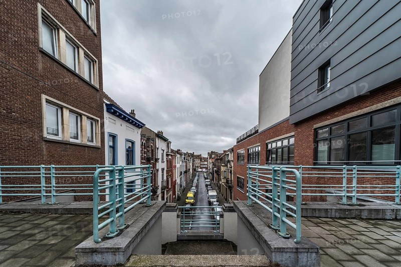 Belgium, 03 15 2019: The symmetric diagonal staircase of the dead end Auguste Snieder street with a view on traditional residential houses, Europe