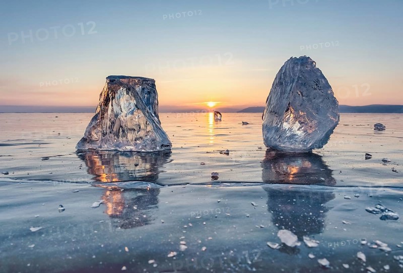 Sunset on frozen Lake Baikal landscape, sunlight is refracted in pieces of ice