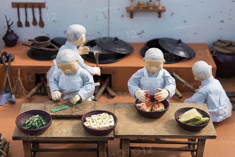 Korean monk figures preparing traditional korean food