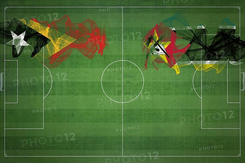 East Timor vs Mozambique Soccer Match, national colors, national flags, soccer field, football game, Competition concept, Copy space