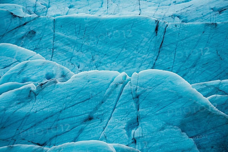 Detailed close-up of a glacier's textured surface with deep blue tones, iceberg, glacier, snow, ice rock, ice diamont, glacier lagoon, nature, snow, diamont beach, Iceland, Europe