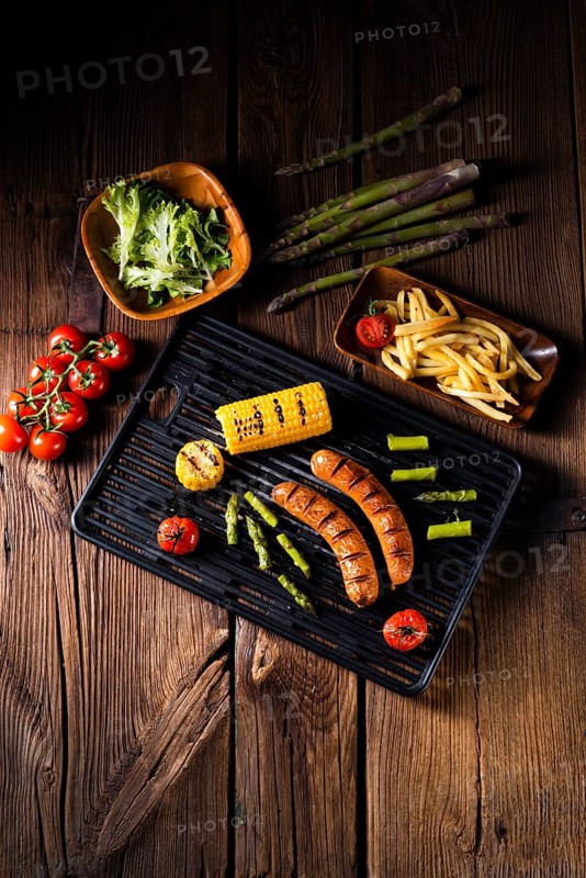 Grilled krakauer with french fries and green salad