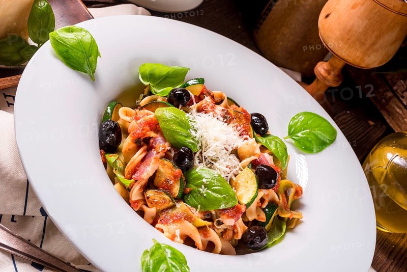Ribbon Pasta with courgette and olives in tomato sauce