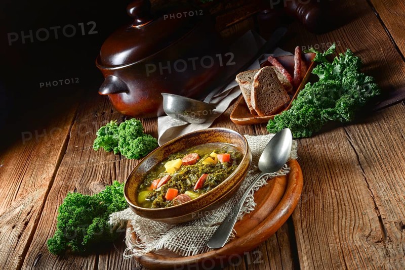 Rustic kale soup with meat and sausage