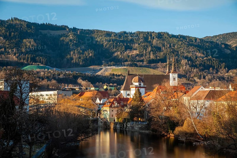 View of the historic city centre, old town of Leoben at the river Mur, Schwammerlturm and church St. Xaver, long exposure, Leoben, Styria, Austria, Europe