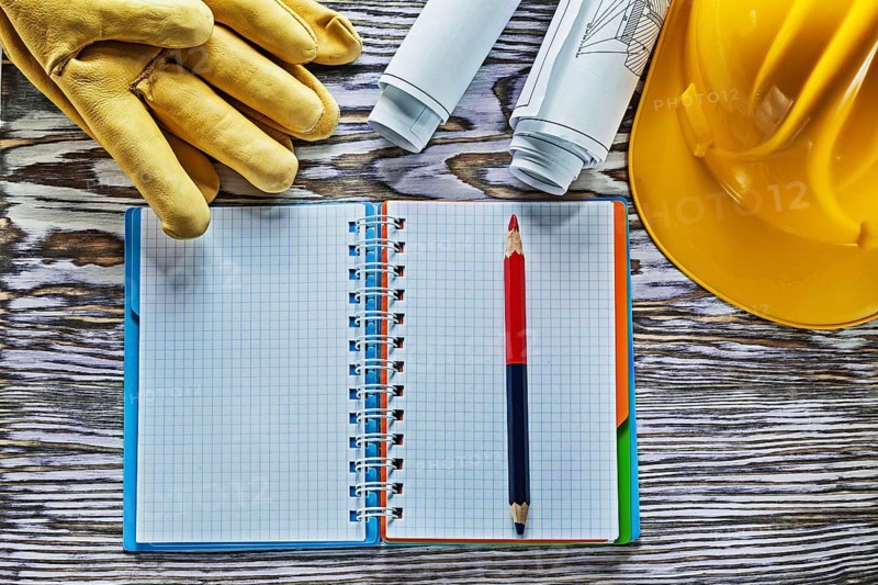 Protective gloves building helmet blueprints notepad pencil