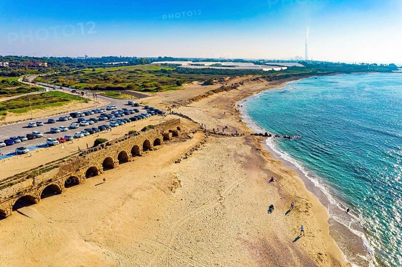 Mediterranean coast. The sandstone aqueduct built during the reign of Herod the Great. January sunny warm and clear day. Aerial view photos. Caesarea. Israel