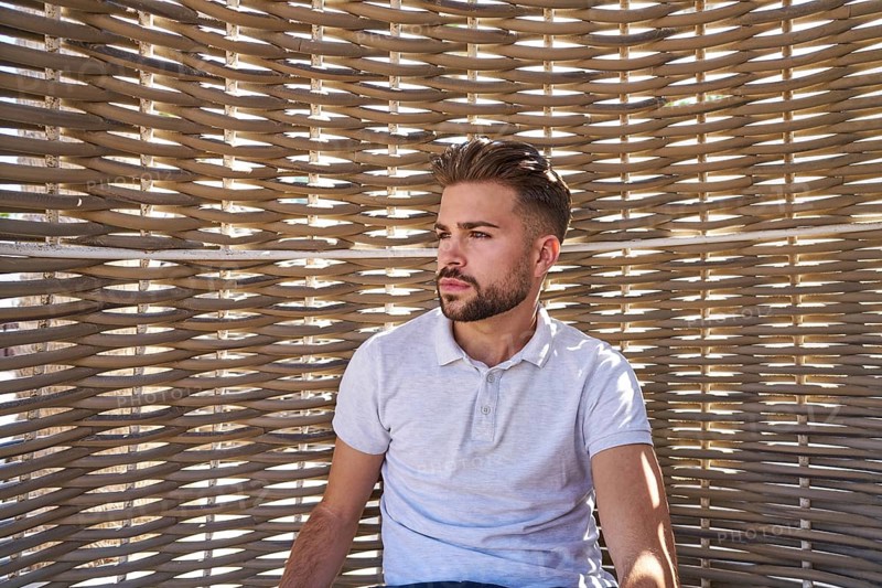 Young beard man relaxed in a beach hammock