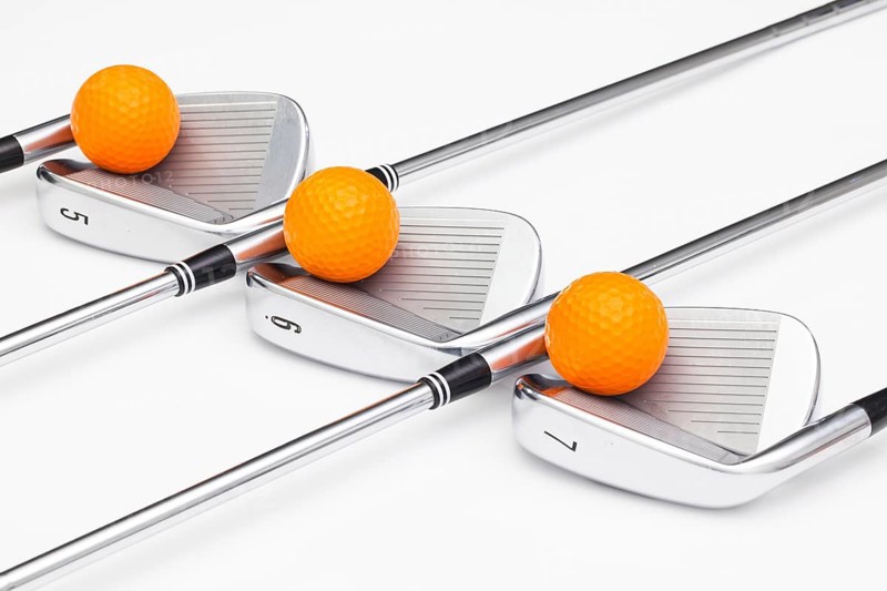 Titanium golf clubs on the white background