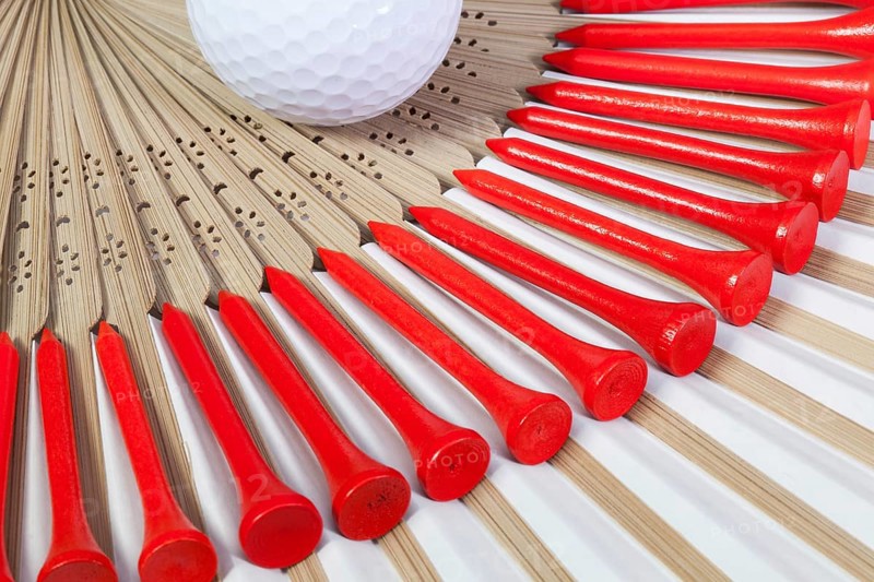 Typical Japanese hand fan made of bamboo and golf equipments