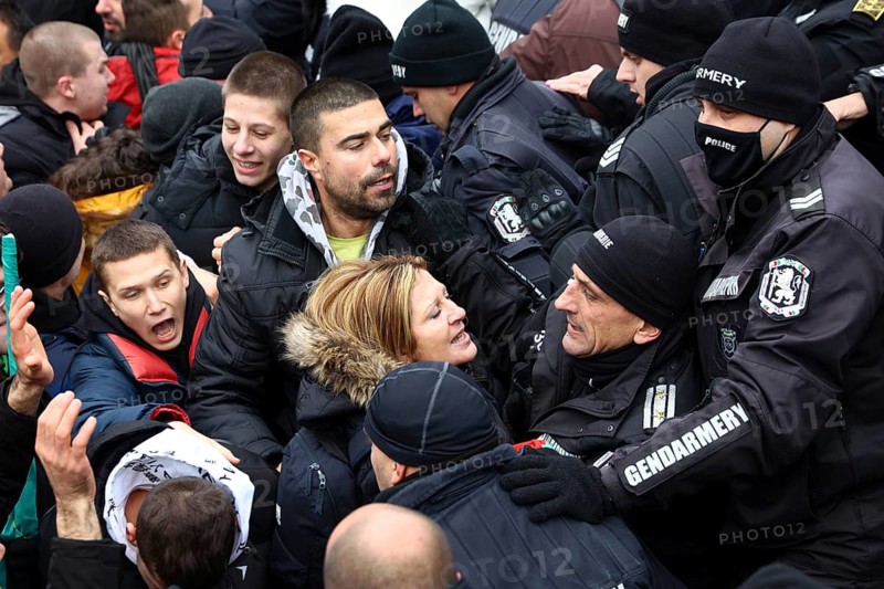 Sofia, Bulgaria - 12 January, 2022: People try to enter the Bulgarian Parliament building during a protest against green certificate (EU Digital COVID Certificate) and vaccination against COVID-19, Sofia, Bulgaria, Europe