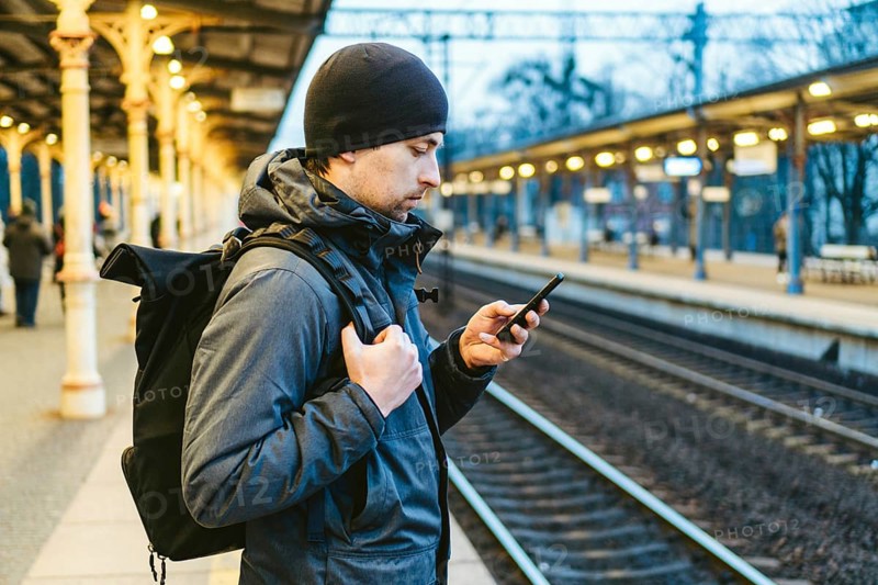 Sopot Railway station. traveler waiting for transportation. Travel concept. Man at the train station. Portrait Of Caucasian Male In Railway Train Station. Handsome commuter while waiting for his train