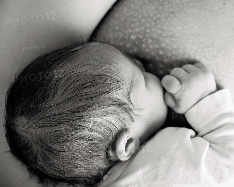 Mother breast feeding her baby