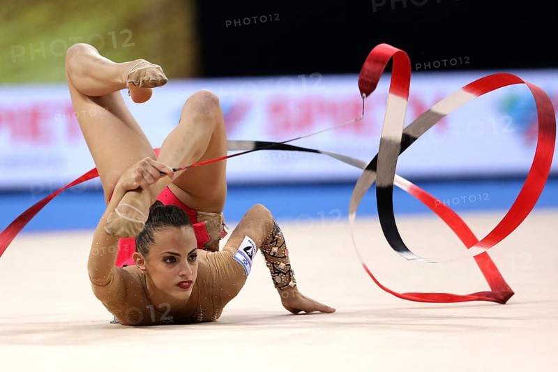 Sofia, Bulgaria - 14 September, 2018: Linoy ASHRAM from Israel performs with ribbon during The 2018 Rhythmic Gymnastics World Championships. Individual tournament