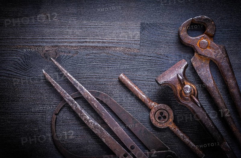 Set of vintage tools on wood board