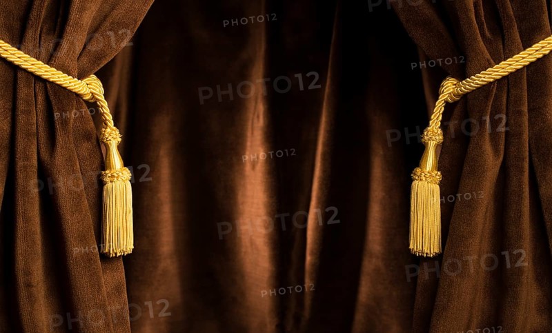 Brown theatre curtain and yellow tassels