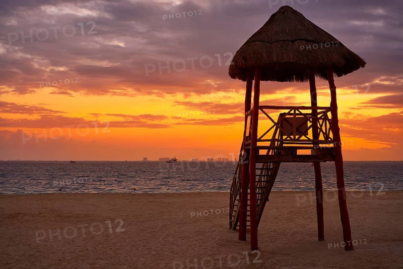 Isla Mujeres island Caribbean beach sunset baywatch tower Riviera Maya Mexico