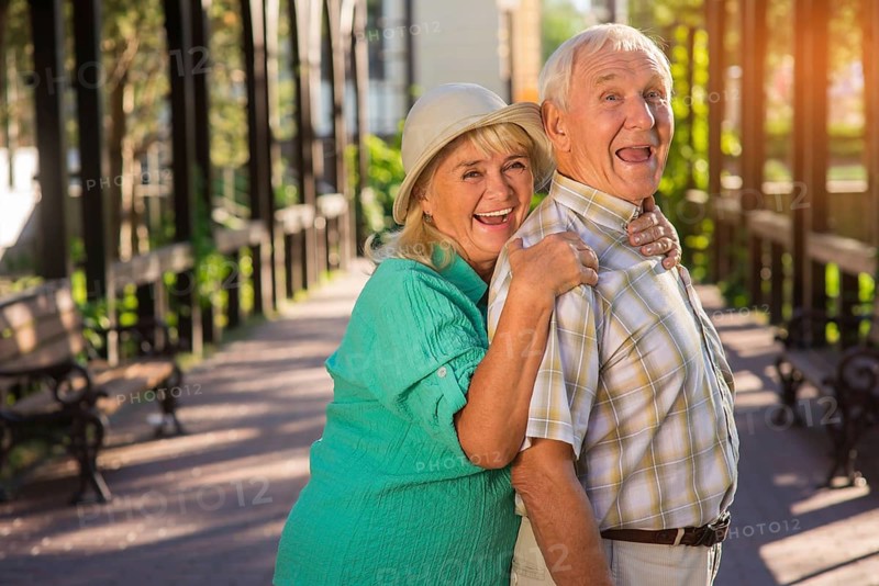 Senior woman hugging man. Elderly couple is laughing. Trust and support. Live entire life together