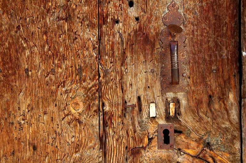 Aged wood door grunge texture rusty handle vintage wooden detail