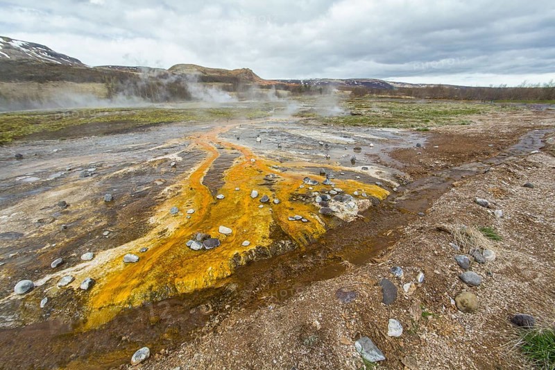 Colorful rock at the geothermal field around Haukadalur geyser, Iceland, Europe