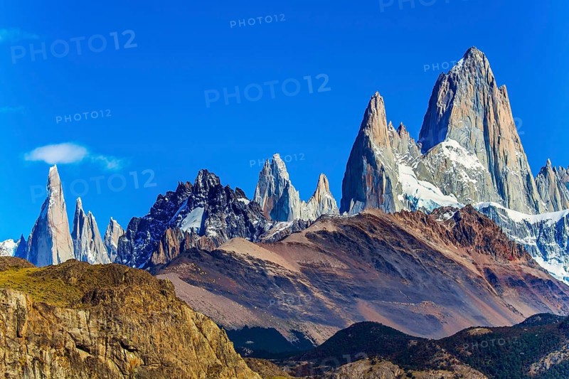Fitzroi or Chaltel - mountain peak in Patagonia between Argentina and Chile. Magnificent mountain range, illuminated by the midday sun. The concept of extreme, active and photo tourism