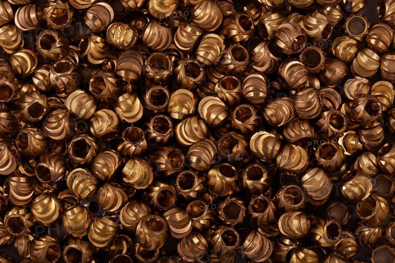 Golden beads close-up on a background
