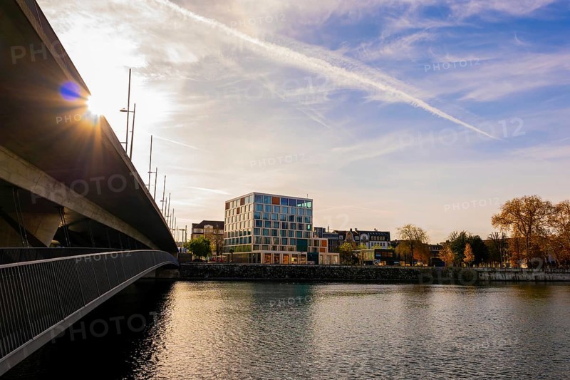 Modern Building and a Bridge over River Aare with Sunbeam in a Sunny Autumn Day in Solothurn, Canton Solothurn, Switzerland, Europe