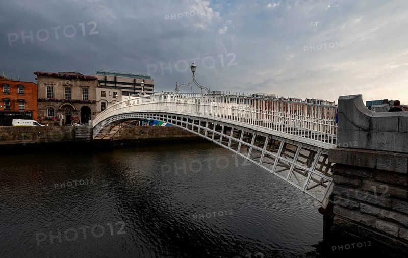 Dublin, Ireland, UK, June 19, 2022: Famous landmark of Ha' penny bridge over the river liffey Dublin, ireland, Europe