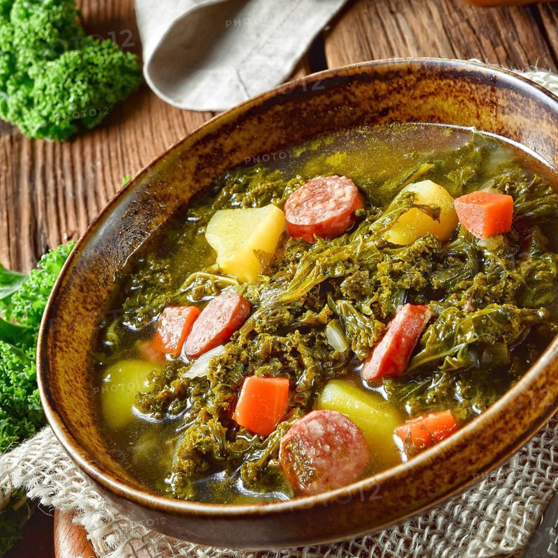 Rustic kale soup with meat and sausage