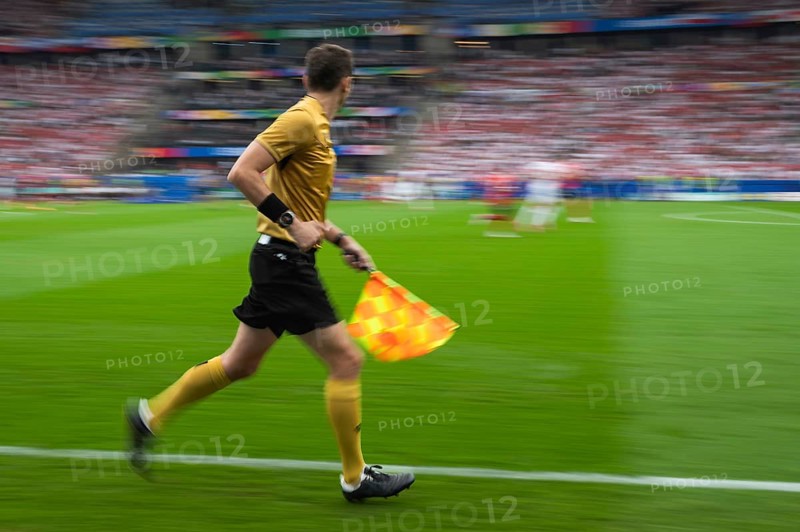 Soccer sideline referee runs during the match - intentional blurry