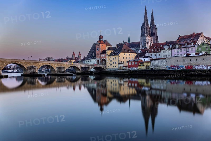 View over the Danube to the Regensburg Cathedral and the Stone Bridge in Regensburg, Bavaria, Germany, in the evening, Europe
