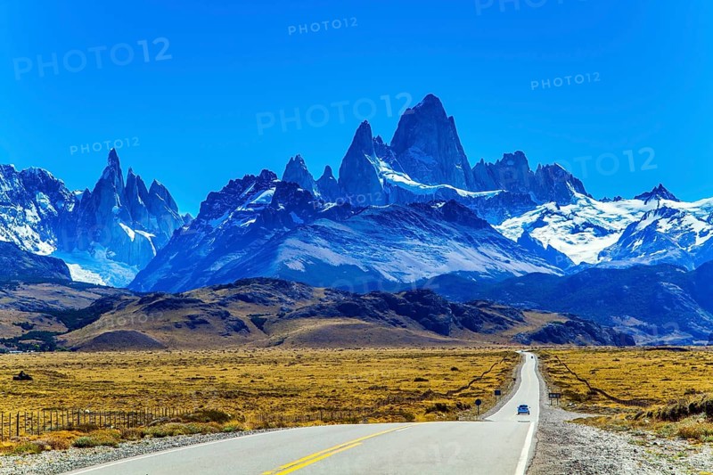 The road to the mountains. The border area between Argentina and Chile. Highway through the desert Patagonia goes to the magnificent mountain range Fitzroy. The concept of extreme, active and photo tourism