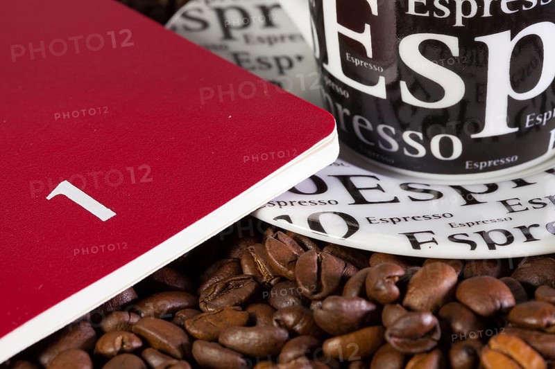 Coffee beans, cup of coffe and diary for January
